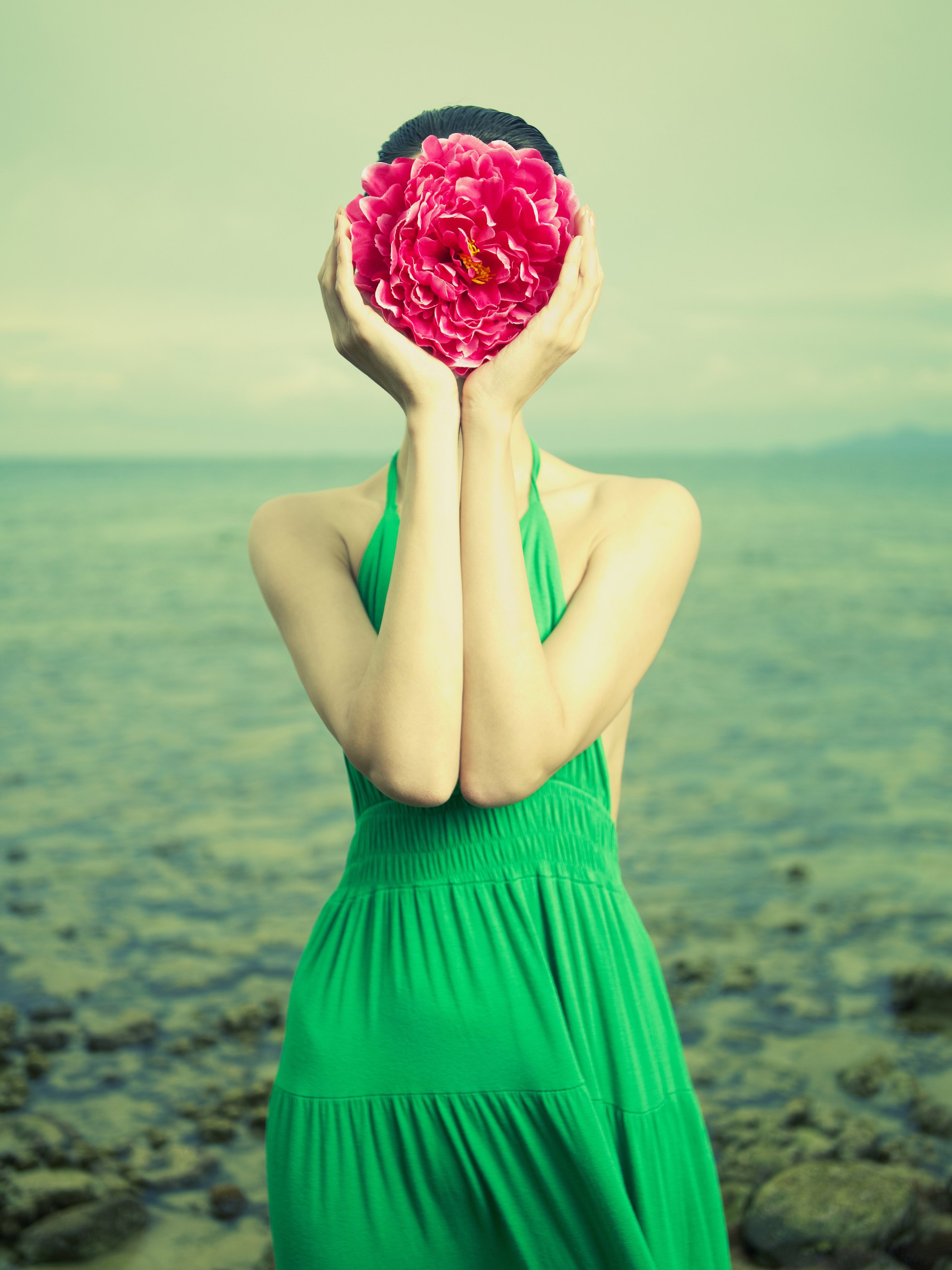 Surreal portrait of a woman with a flower instead of a face