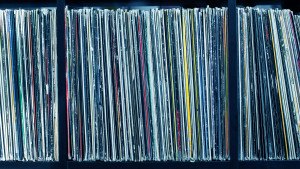 Stack of old vinyl records. blue tone