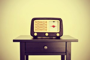 picture of an antique radio receptor on a desk, with a retro effect