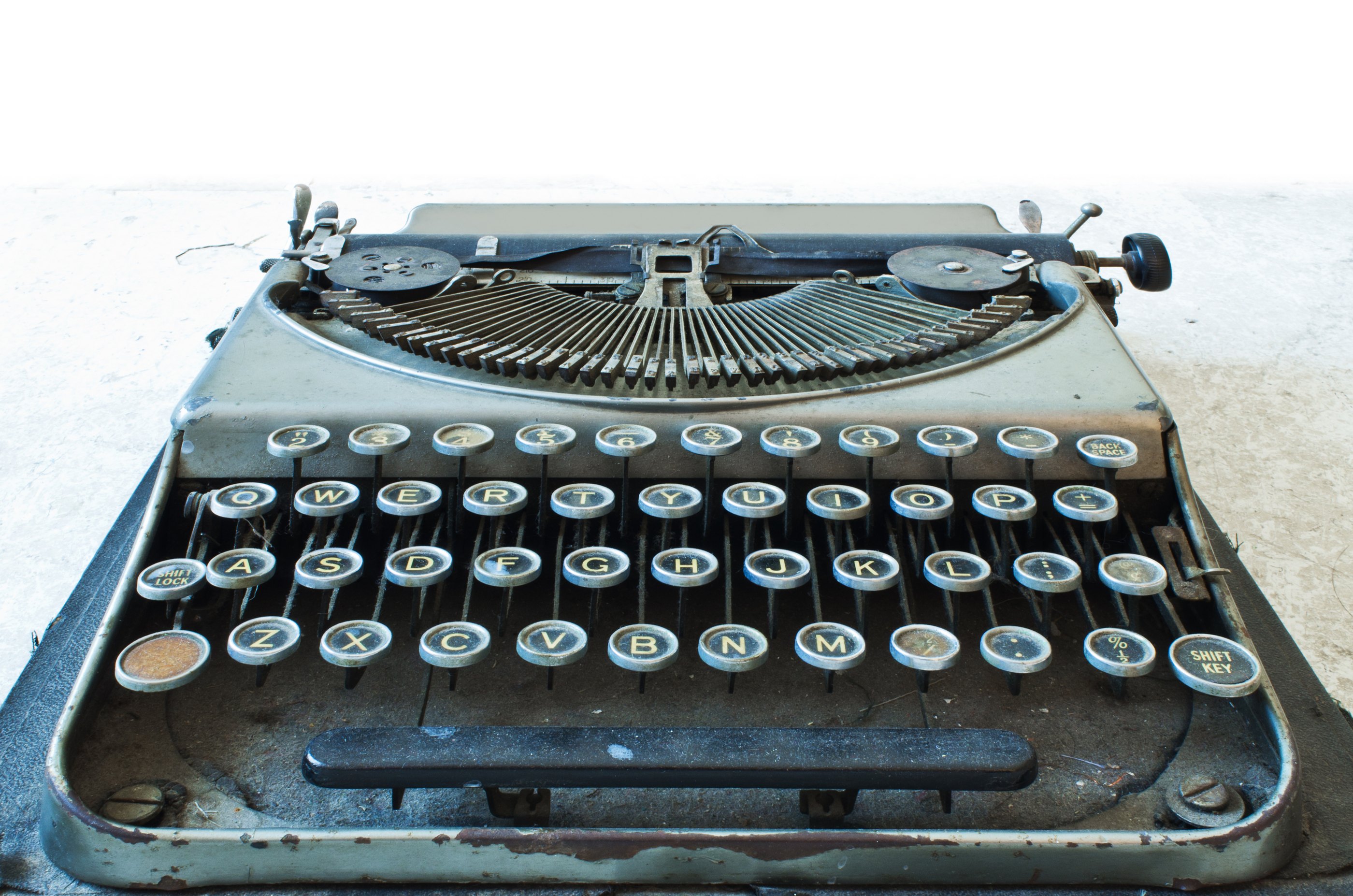 Old Antique typewriter keyboard isolated on white