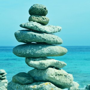 picture of a typical stack of balanced stones in Cap de Cavalleria, Menorca, Balearic Islands, Spain, with a retro effect